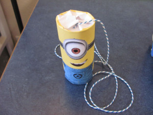 a completed mini minion pinata ready to party